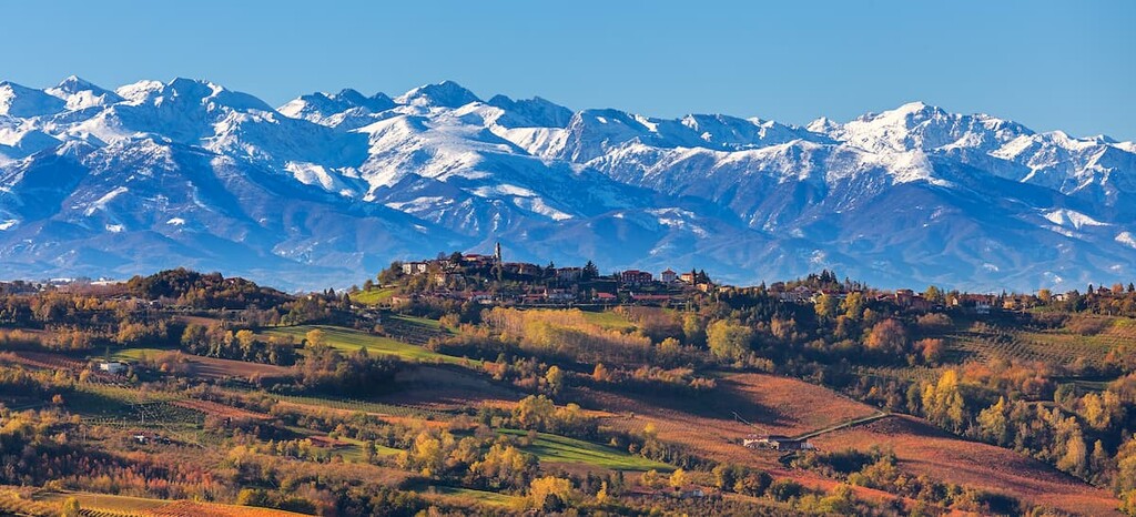 Rolling green hills and distant peaks in northern Italy’s Piedmont region, homeland of connected Waldensian families